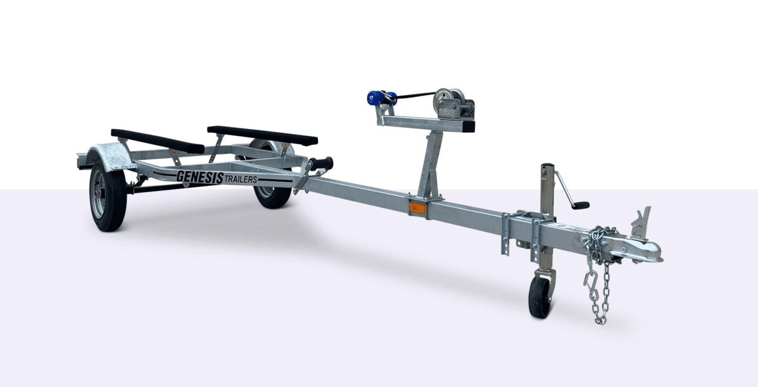 A metal boat trailer with a single axle, winch, support bunks, and a tow hitch, shown on a plain white background.