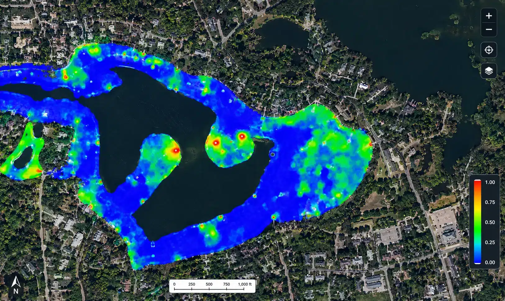 Aerial map of a lake with heatmap overlay showing varying intensities from blue to red, indicating data concentration in specific areas near the shore.